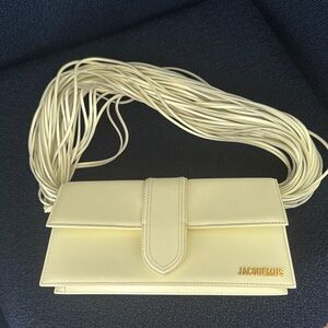 Jacquemus Le bambino long ficiu light yellow shoulder bag with Strap Detail